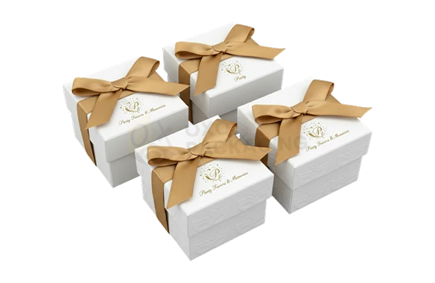 gold and white favor boxes